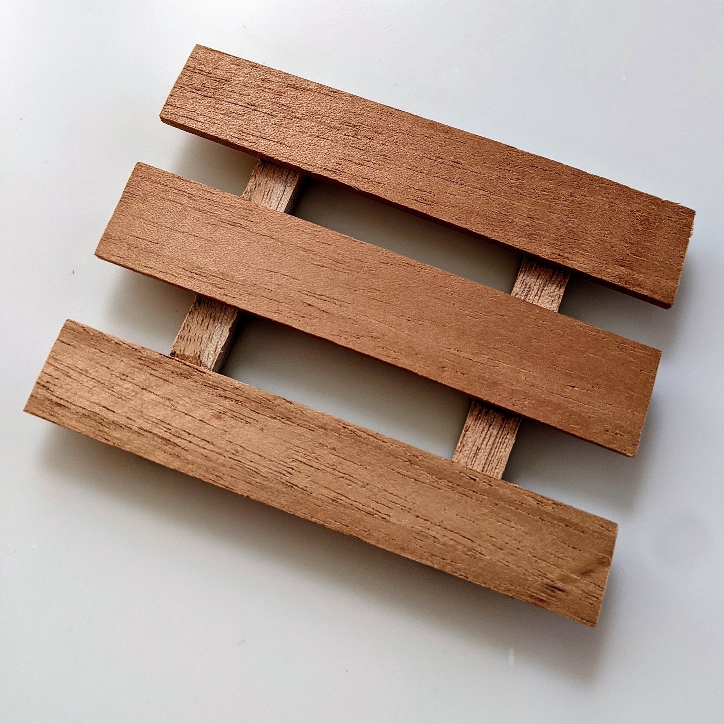 The pallet soap dish is a classic. It allows water do drain through helping your soap dry faster and last longer.