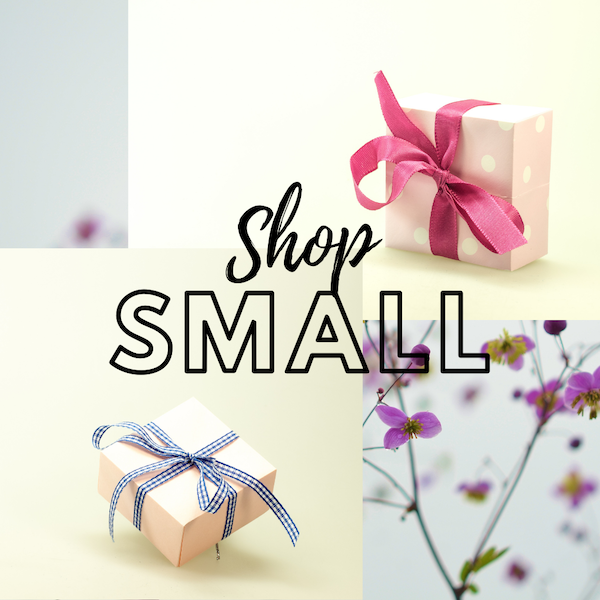 two gift boxes on a background with ethereal purple flowers with the words Shop Small in the center.