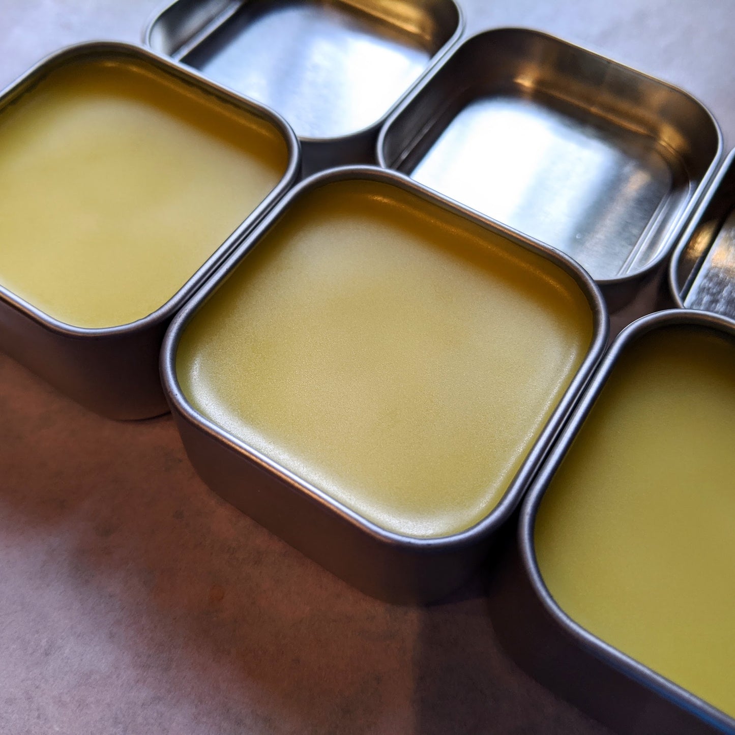 Open tins of butcher's block wax with a silky blend of olive oil and beeswax to revitalize wood, leather and more.