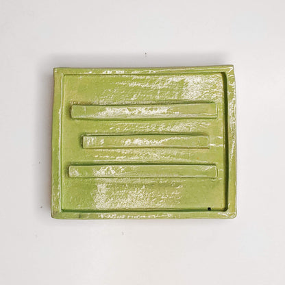Green Water soap dish with ribs to help keep the soap dry.