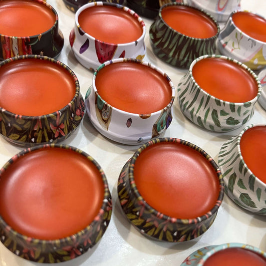 colorful tins with lush red lip balm