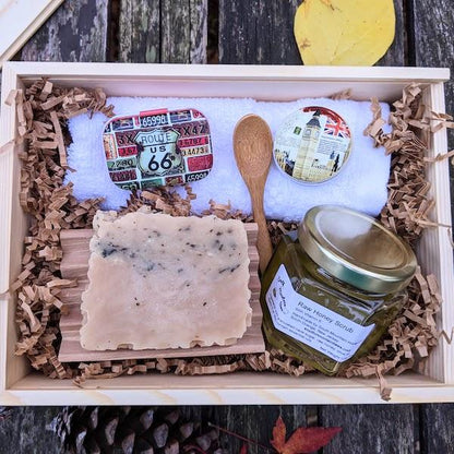 The Caring Gift Box is the perfect collection for winter skin care. It has raw honey scrub with bamboo spoon, handcrafted natural soap, beeswax lip balm in cute tin, soothing salve, beech wood soap dish, and a hotel grade 100% cotton washcloth,  in adorable, reusable, fragrant sliding top pine wood box.