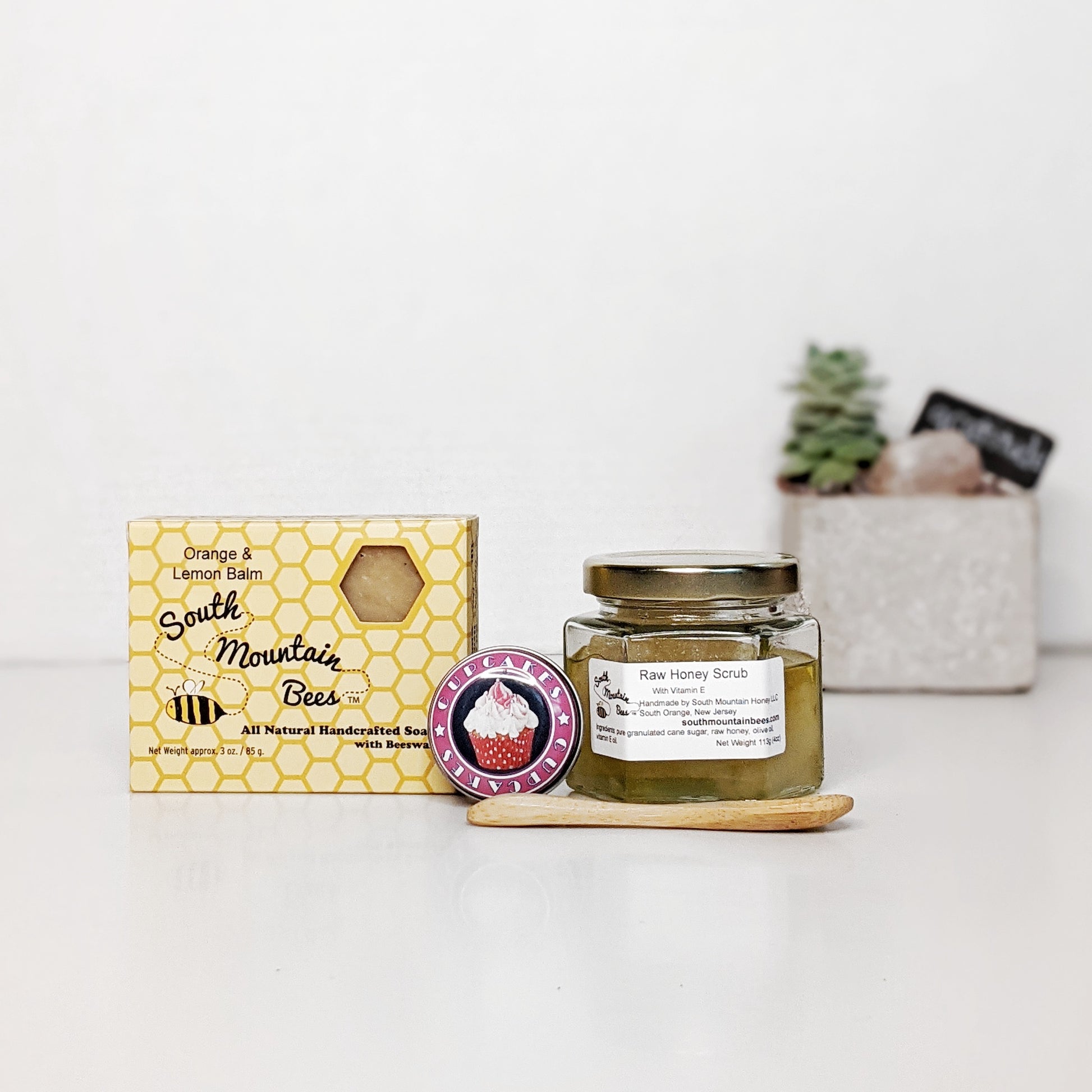 The Hero Teacher Gift is a pampering set with two award winning products: a handcrafted natural soap and a beeswax lip balm, together with our popular raw honey scrub with a free bamboo spoon.