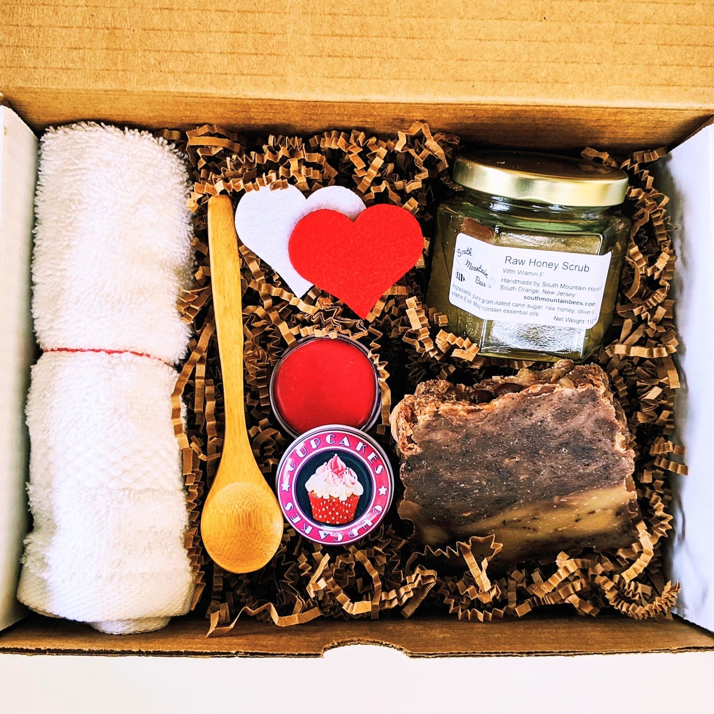 An assortment of natural products to pamper your self or  that special person. The box contains a raw honey scrub with a bamboo spoon, a cherry lip balm for the best kisses, and a honey soap for the best fragrance without the calories!
