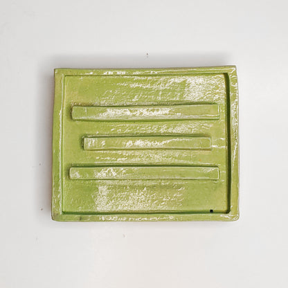 green water soap dish with ribs to keep the soap dry.